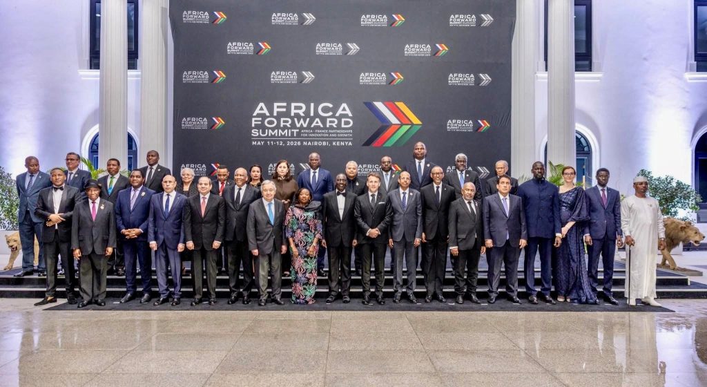 Group of dignitaries in formal attire posing on steps in front of an Africa Forward Summit backdrop in Nairobi, Kenya (May 11–12, 2026).