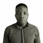 Portrait of a young Black man with short hair, wearing a patterned button-down shirt, looking directly at the camera against a white background.