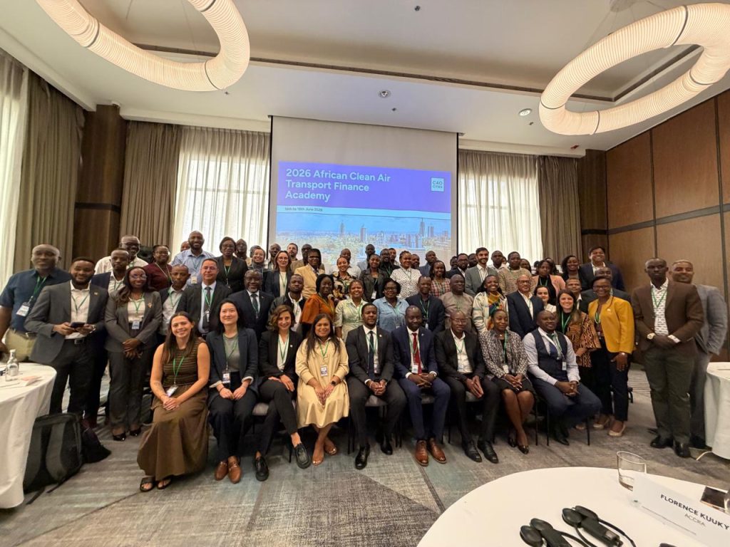 Group photo of diverse participants at the 2026 African Clean Air Transport Finance Academy, posing in a conference room with a projection screen behind them.
