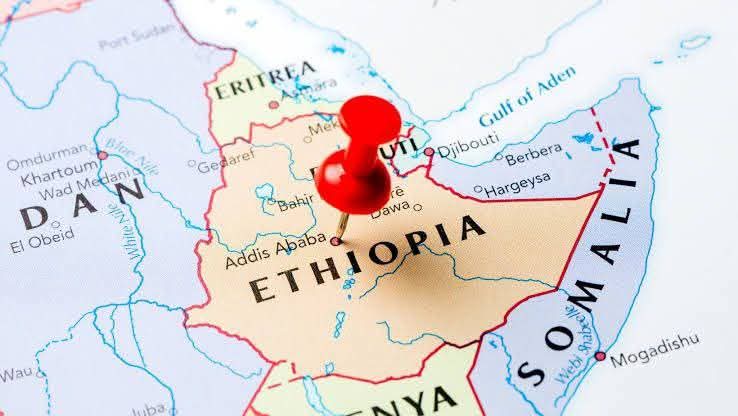 Map of Ethiopia in the Horn of Africa with a red pushpin marking central Ethiopia near Addis Ababa, showing neighboring countries Eritrea, Djibouti, Somalia and surrounding borders.