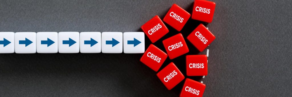 Row of white cubes with blue right-pointing arrows, leading into a cluster of red cubes labeled CRISIS.