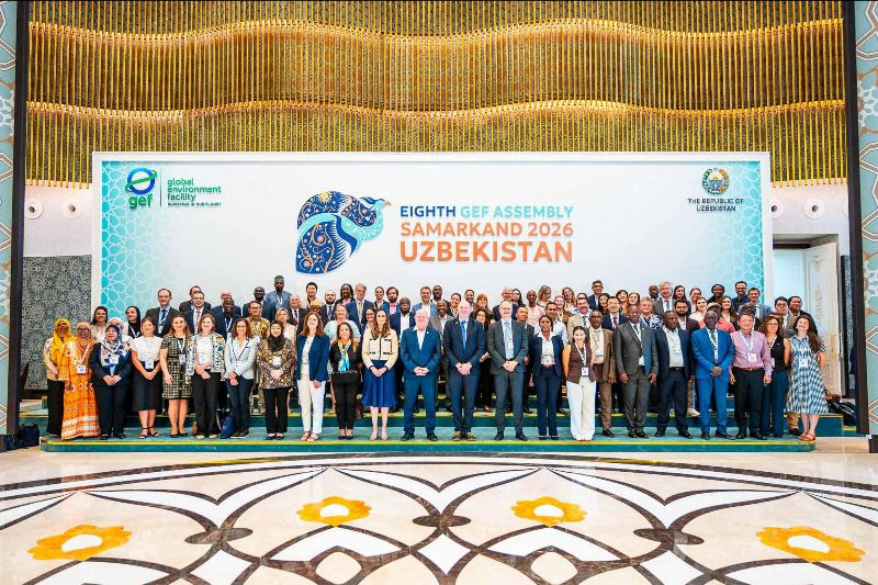 Group of diverse attendees posing on a stage at the Eighth GEF Assembly in Samarkand 2026, Uzbekistan.