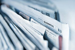 Newspapers on a desk, illustrating a weekly roundup of the most-read news stories